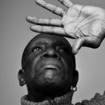 Tony Allen (Bernard Benant) looking up at hand
