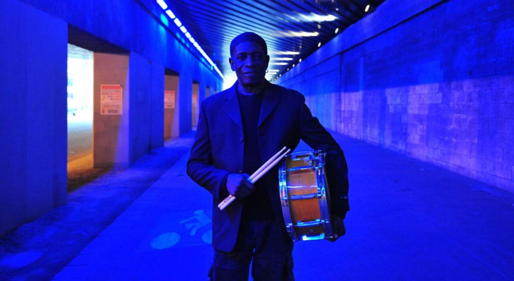 Tony Allen in blue corridor